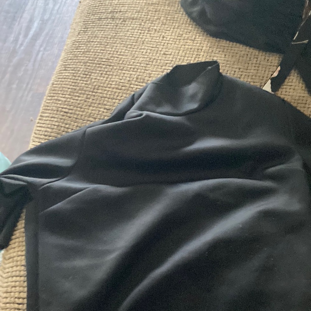 All black turtle kneck shirt shirt sleeve